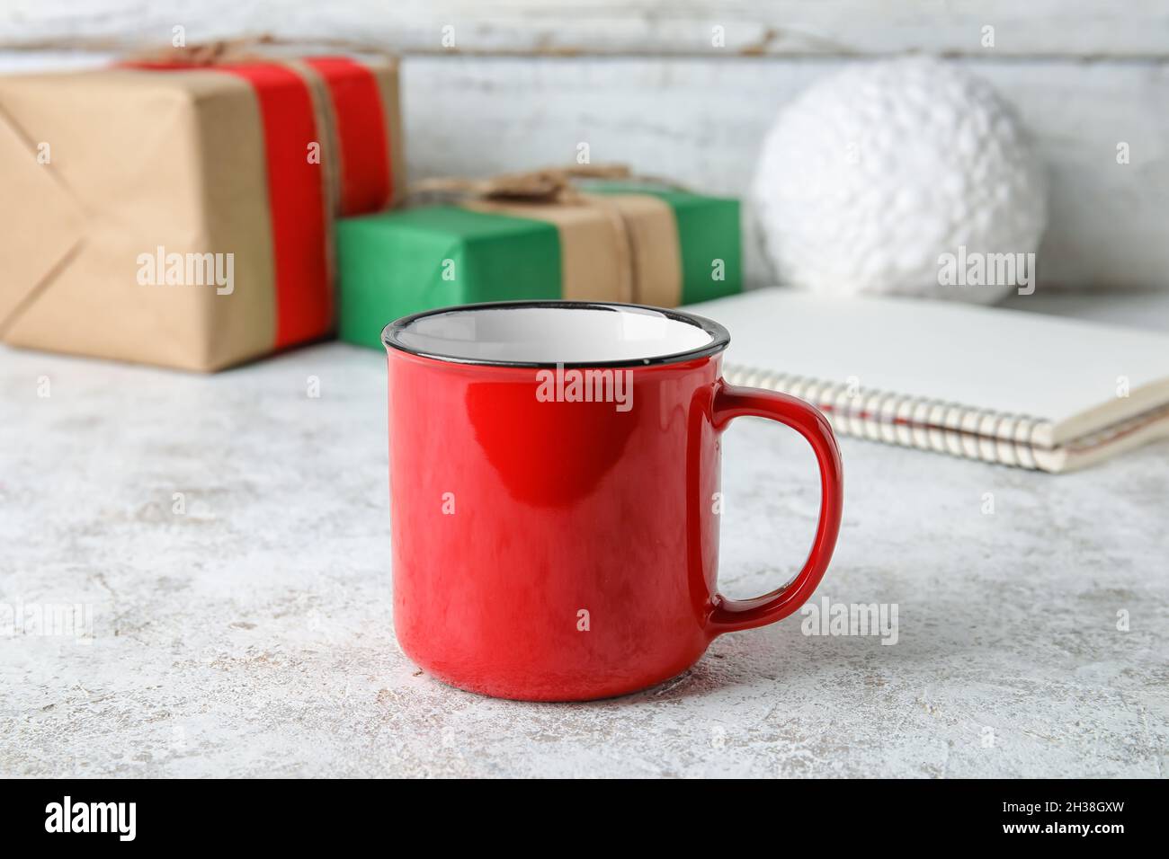 Stylish red cup on table Stock Photo