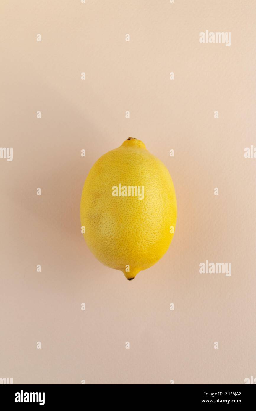 lemon on pink background, flat lay view Stock Photo
