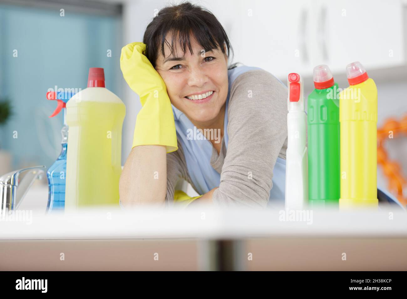 Mature woman cleaning supplies hi-res stock photography and images - Alamy