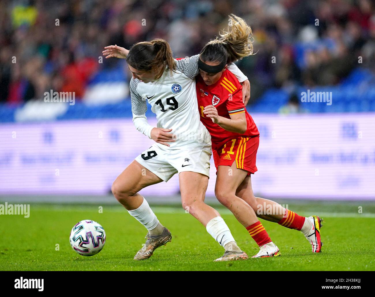 Estonia's Vlada Kubassova (left) and Wales' Natasha Harding battle for the ball during the FIFA Women's World Cup 2023 UEFA Qualifying match at the Cardiff City Stadium. Picture date: Tuesday October 26, 2021. Stock Photo
