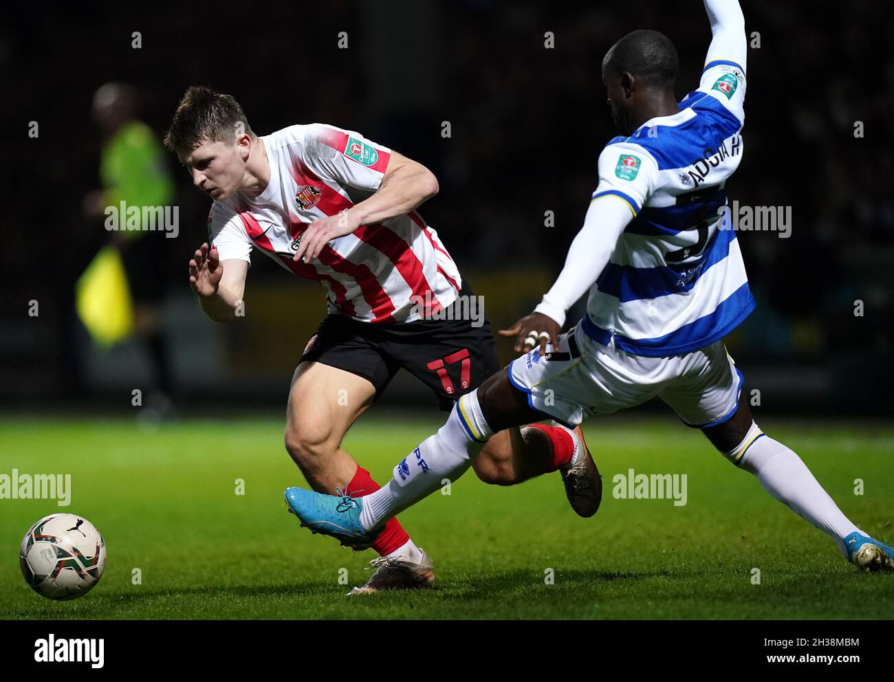 Sunderland's Dennis Cirkin (left) and Queens Park Rangers' Albert Adomah battle for the ball during the Carabao Cup Fourth Round match at the Kiyan Prince Foundation Stadium, London. Picture date: Tuesday October 26, 2021. Stock Photo