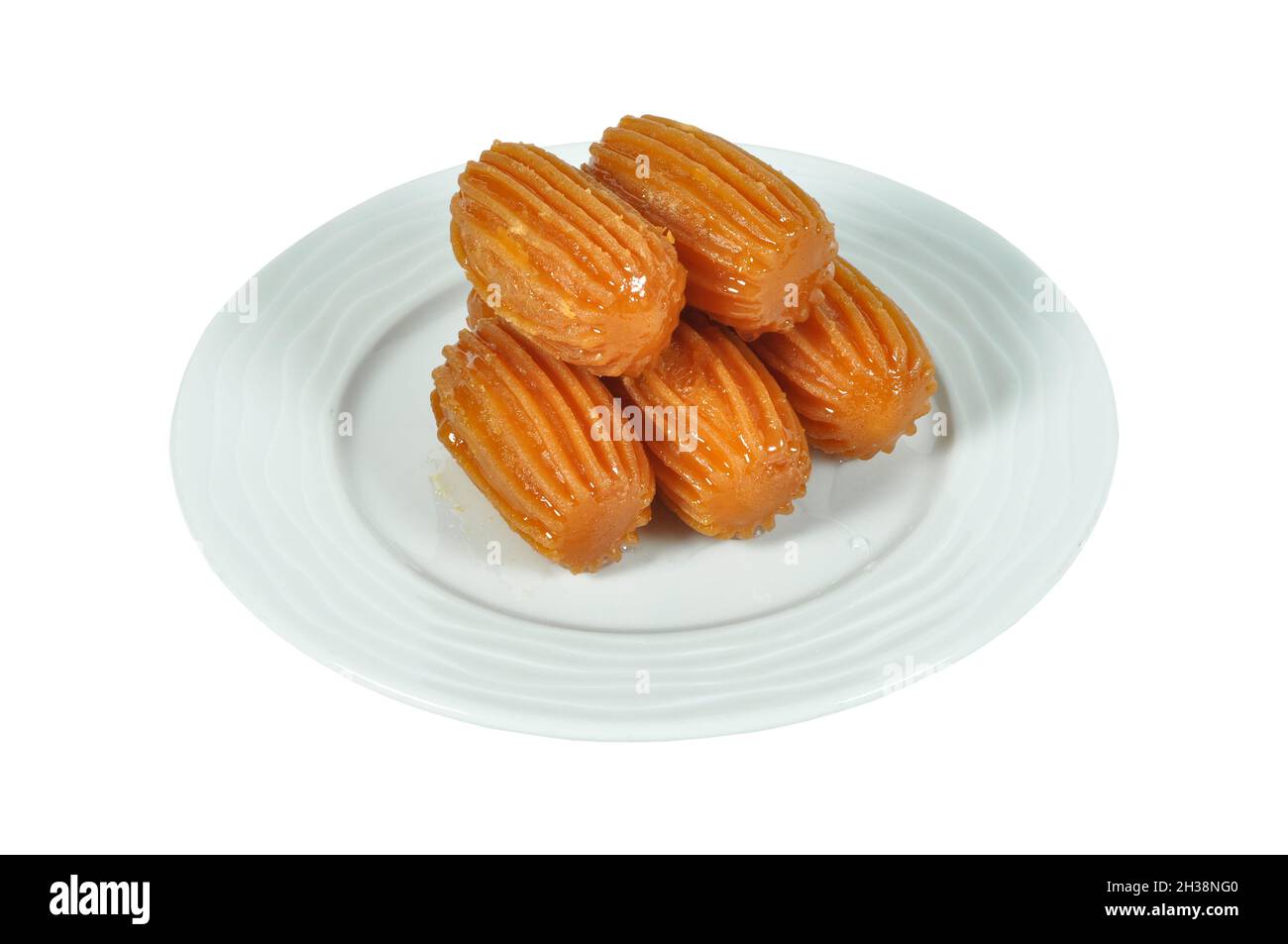 Traditional Turkish dessert tulumba, tulumba tatlisi in plate Stock Photo
