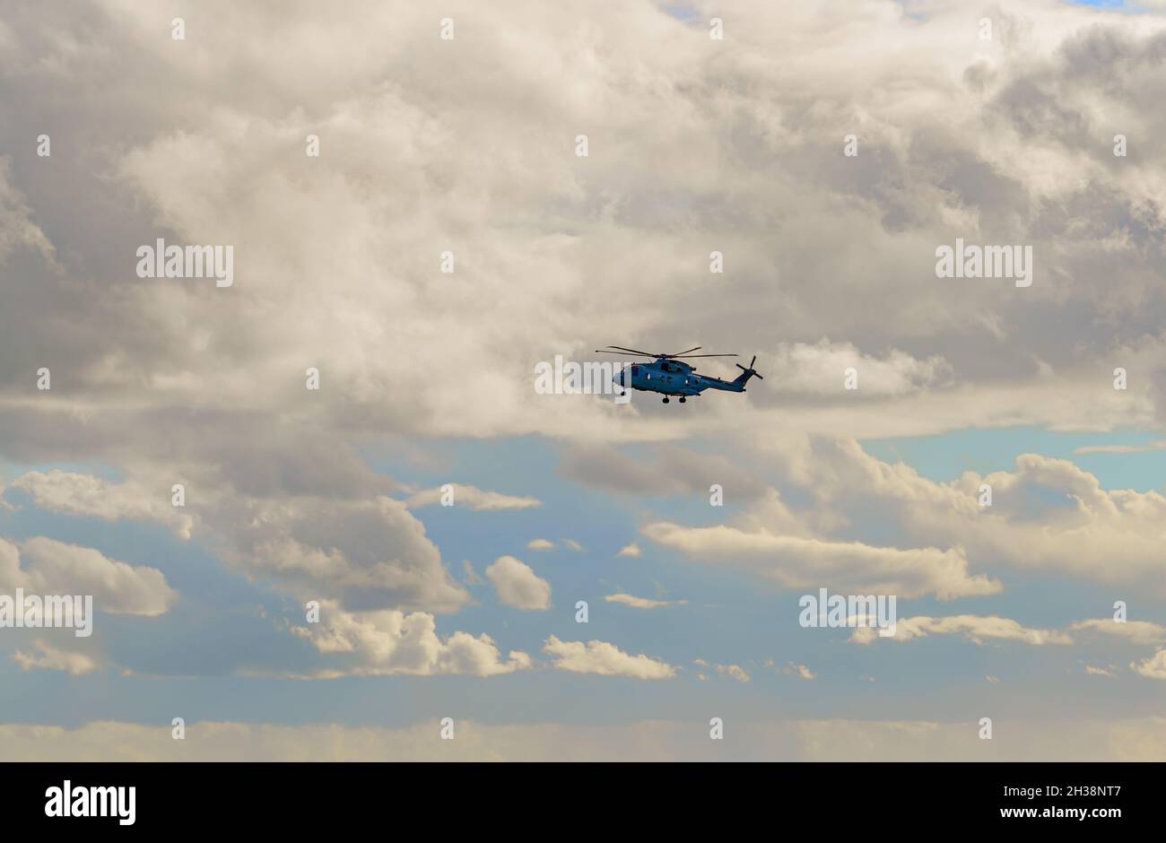 British Royal Navy Agusta-Westland Merlin HM.2 AW101 helicopter flying low  under white cloud on a military exercise over Wiltshire UK Stock Photo -  Alamy