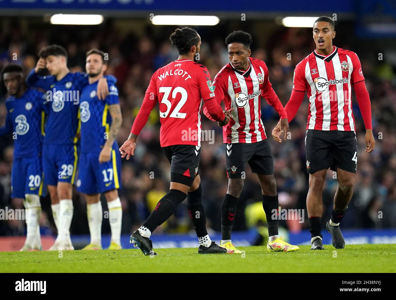 Southampton's Theo Walcott (centre) after missing his shot in the penalty shoot-out during the Carabao Cup Fourth Round match at Stamford Bridge, London. Picture date: Tuesday October 26, 2021. Stock Photo