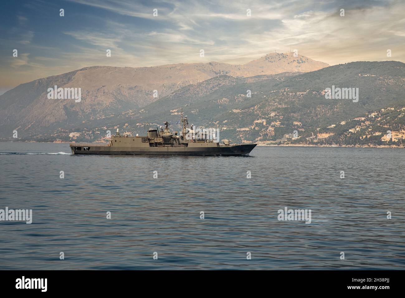 NATO military Greek frigate patrols the coast of Corfu island, Greece Stock Photo