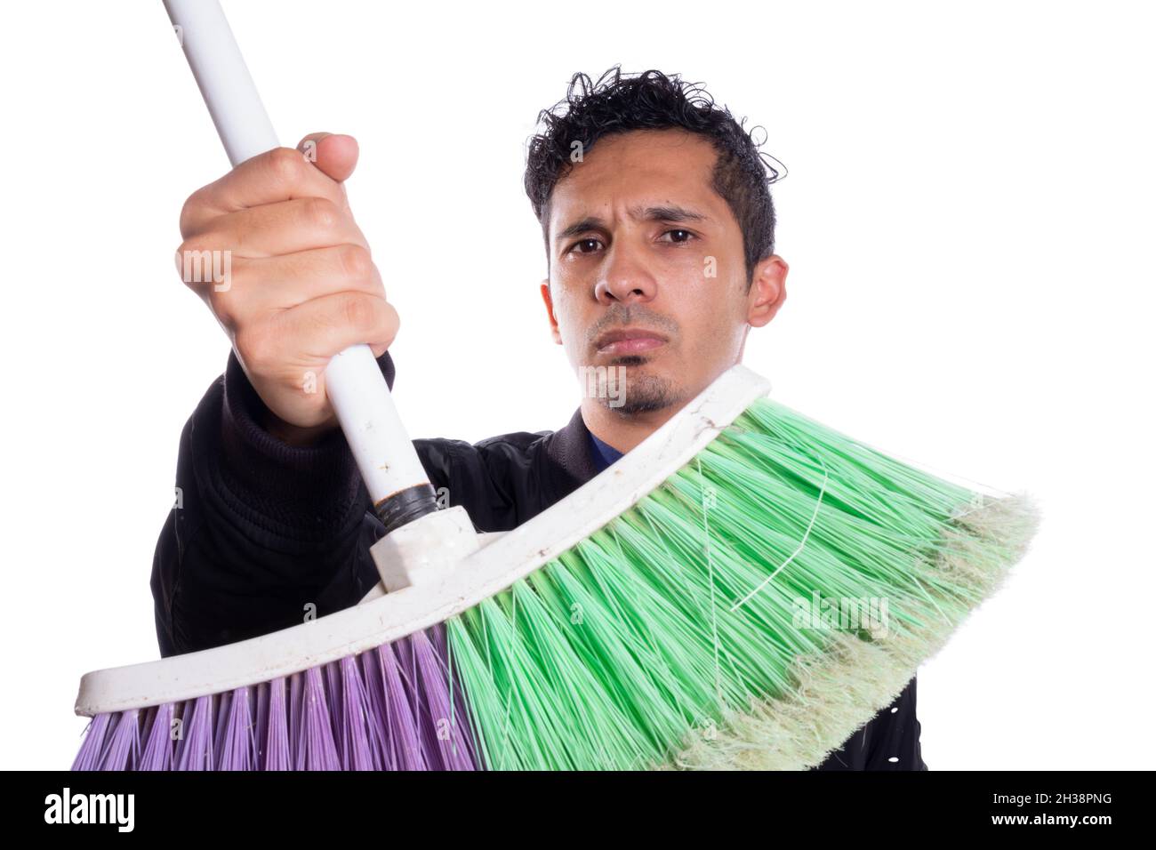 Man showing broom or handing broom on white background. Serious latin