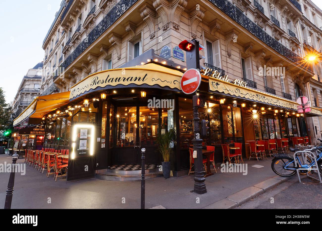 The traditional parisian restaurant Etoile 1903 at night . It located avenue Wagram in Paris, France. Stock Photo