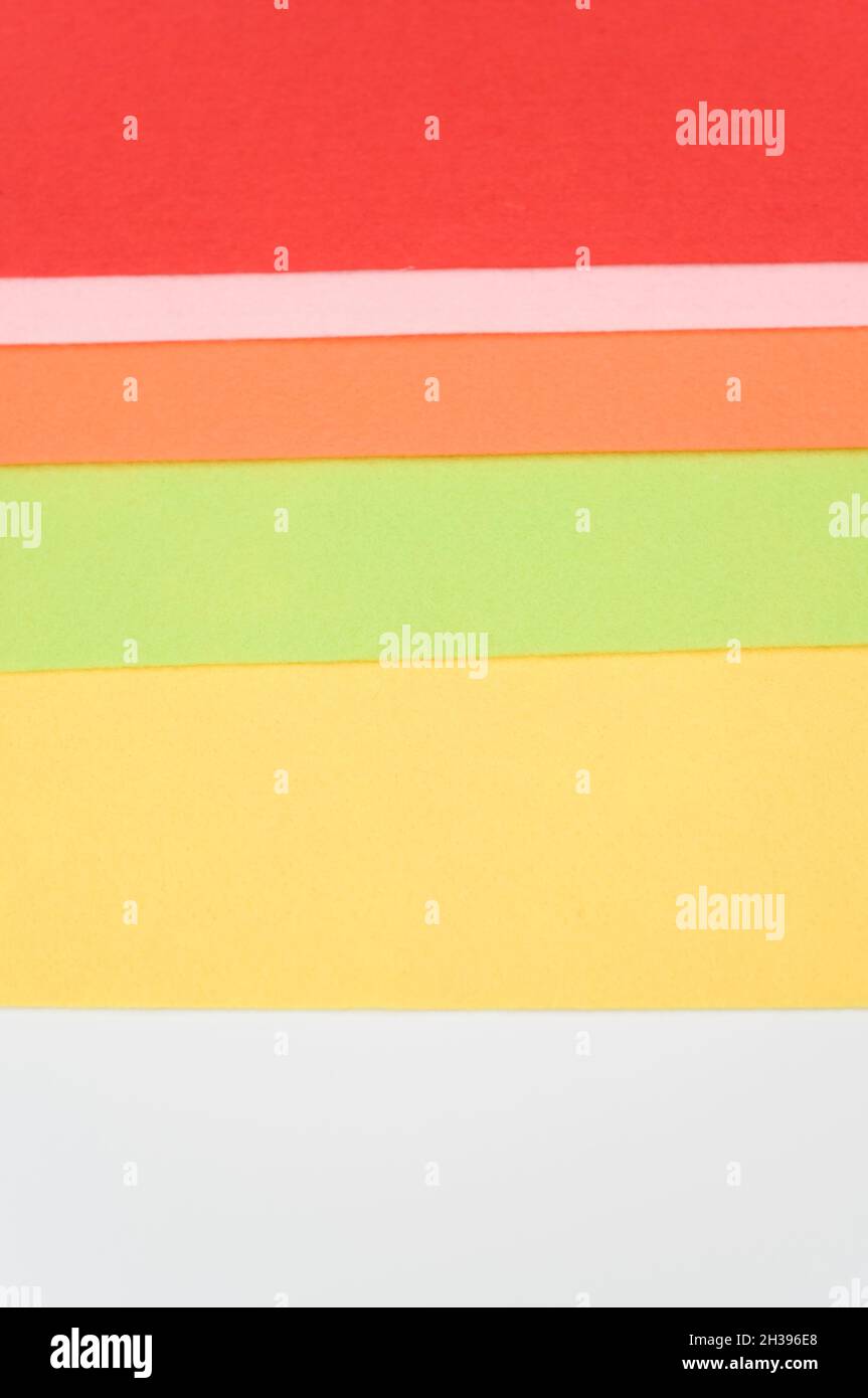 multicolored felt sheets backdrop on a white background Stock Photo - Alamy