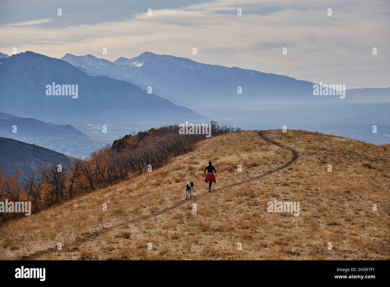 Natural view of hikers on a trail on top of a hill Stock Photo - Alamy