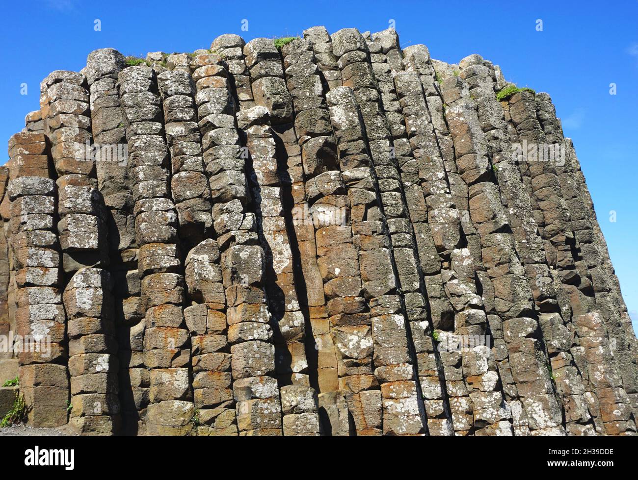 Basalt pillars rock formation formed by volcanic eruption 50 million years ago at The Giant's Causeway, located on the north coast of Northern Ireland Stock Photo