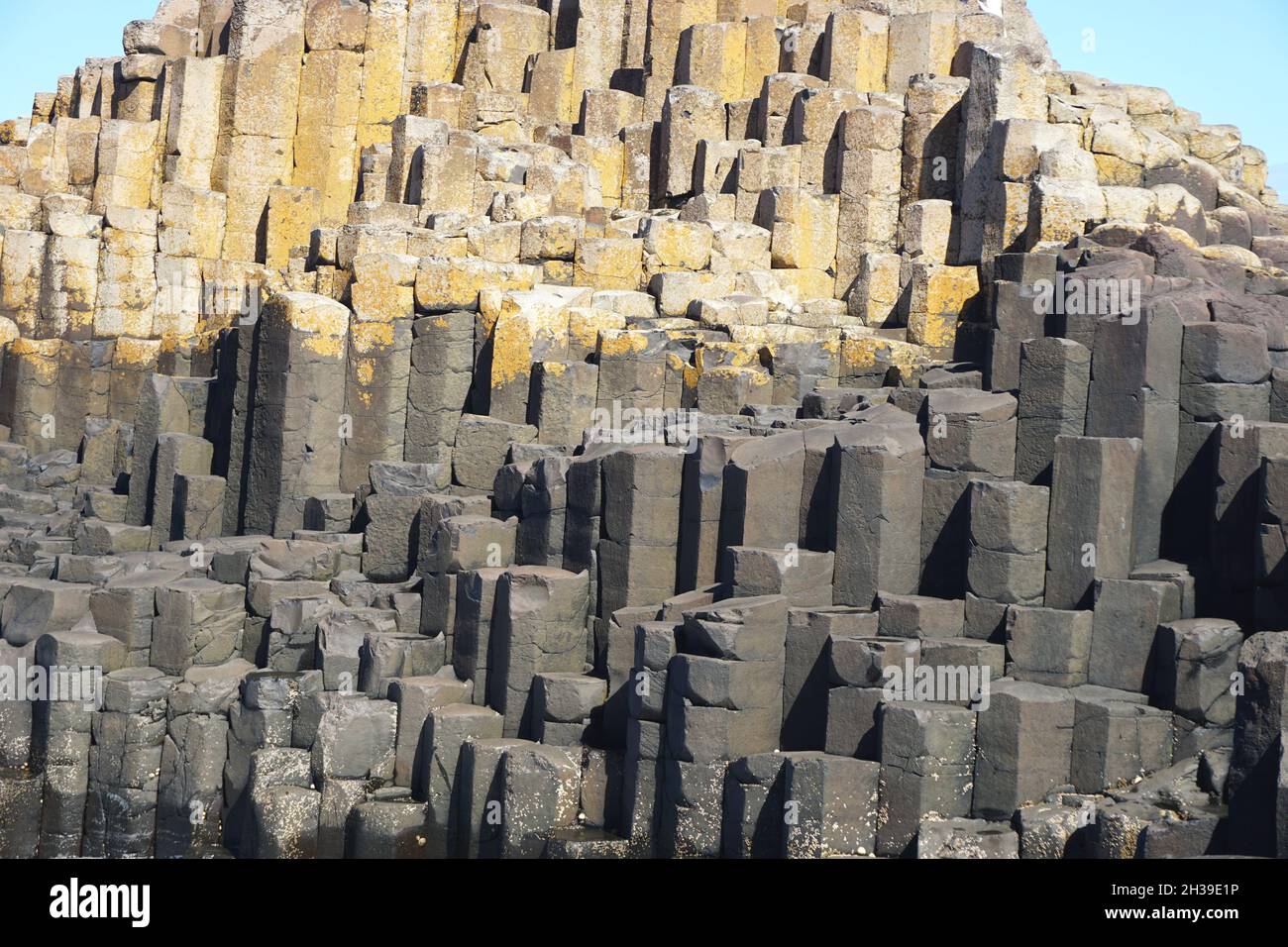 Detail of natural volcanic basalt geometric stone pillar formations at the Giant’s Causeway, in