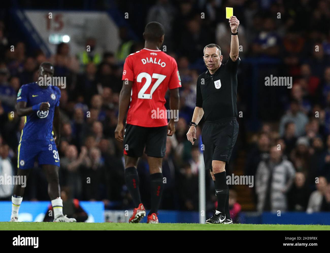London, England, 26th October 2021. Ibrahima Diallo of Southampton is shown a yellow card by referee Kevin Friend during the Carabao Cup match at Stamford Bridge, London. Picture credit should read: Paul Terry / Sportimage Stock Photo