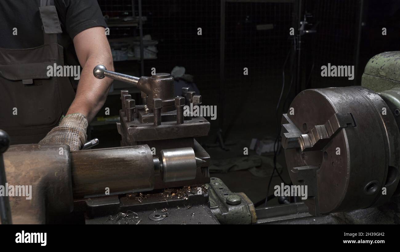 Photo of working process with metal details on lathe machine Stock