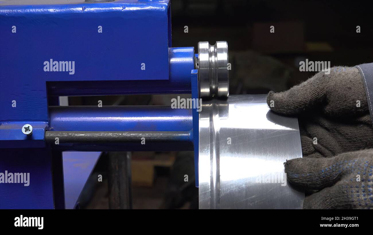 Close-up photo of working metal's sheet bending machine Stock Photo