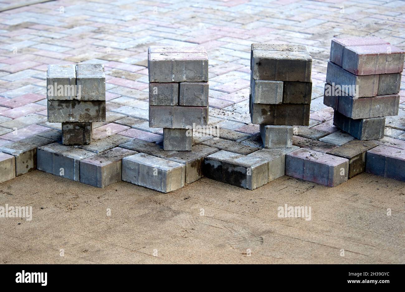 paving slabs prepared for laying on a sand cushion Stock Photo