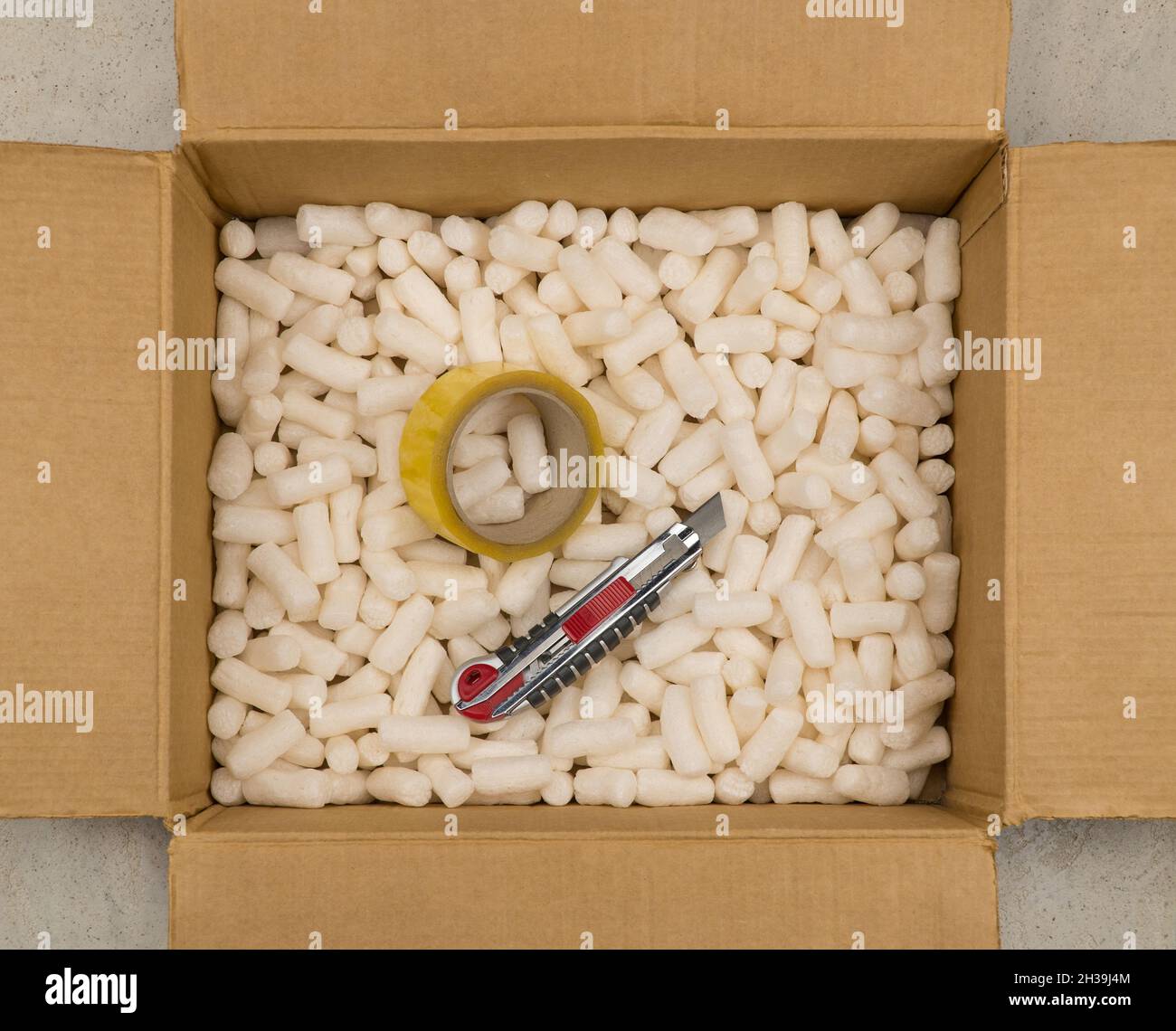 Cardboard box with styrofoam filler for safe packaging. Stationery