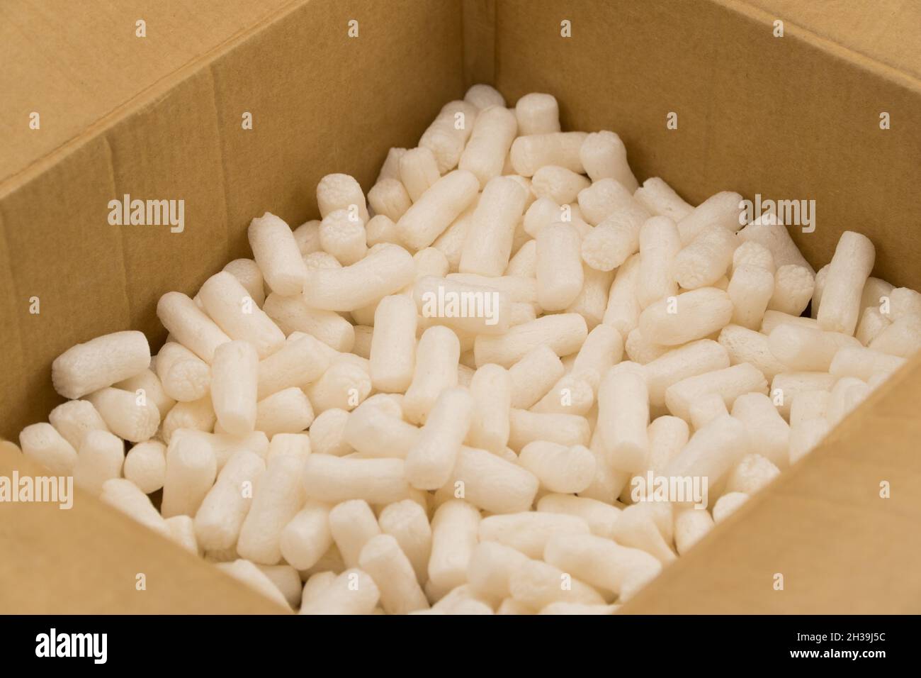 Empty cardboard box with styrofoam filler for safe packaging Stock