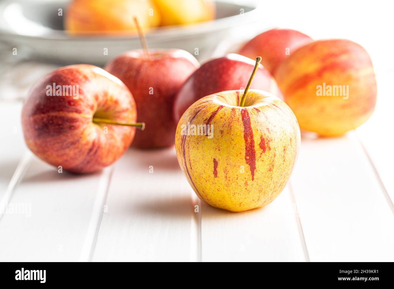 Fresh autumn apples on white table. Stock Photo