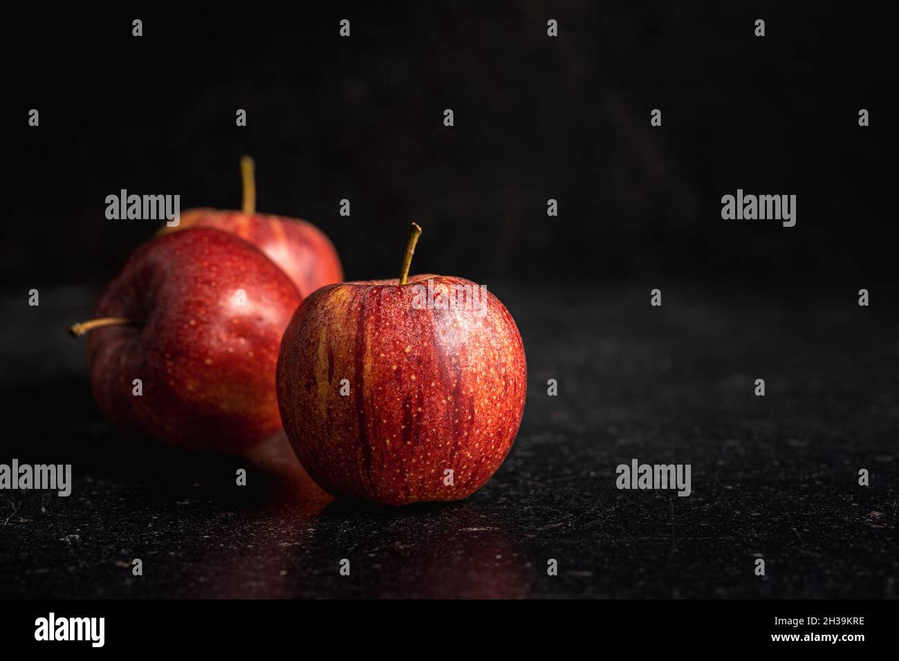 Fresh autumn apples on black table. Stock Photo