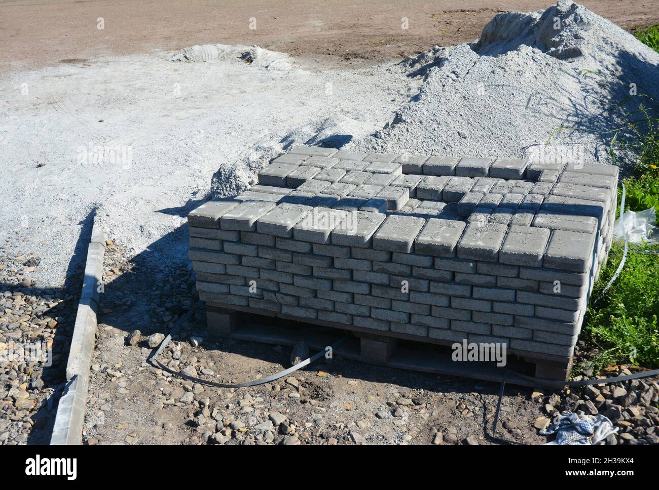 Laying pavement stack. Installing pavers for garden pathway Stock Photo ...