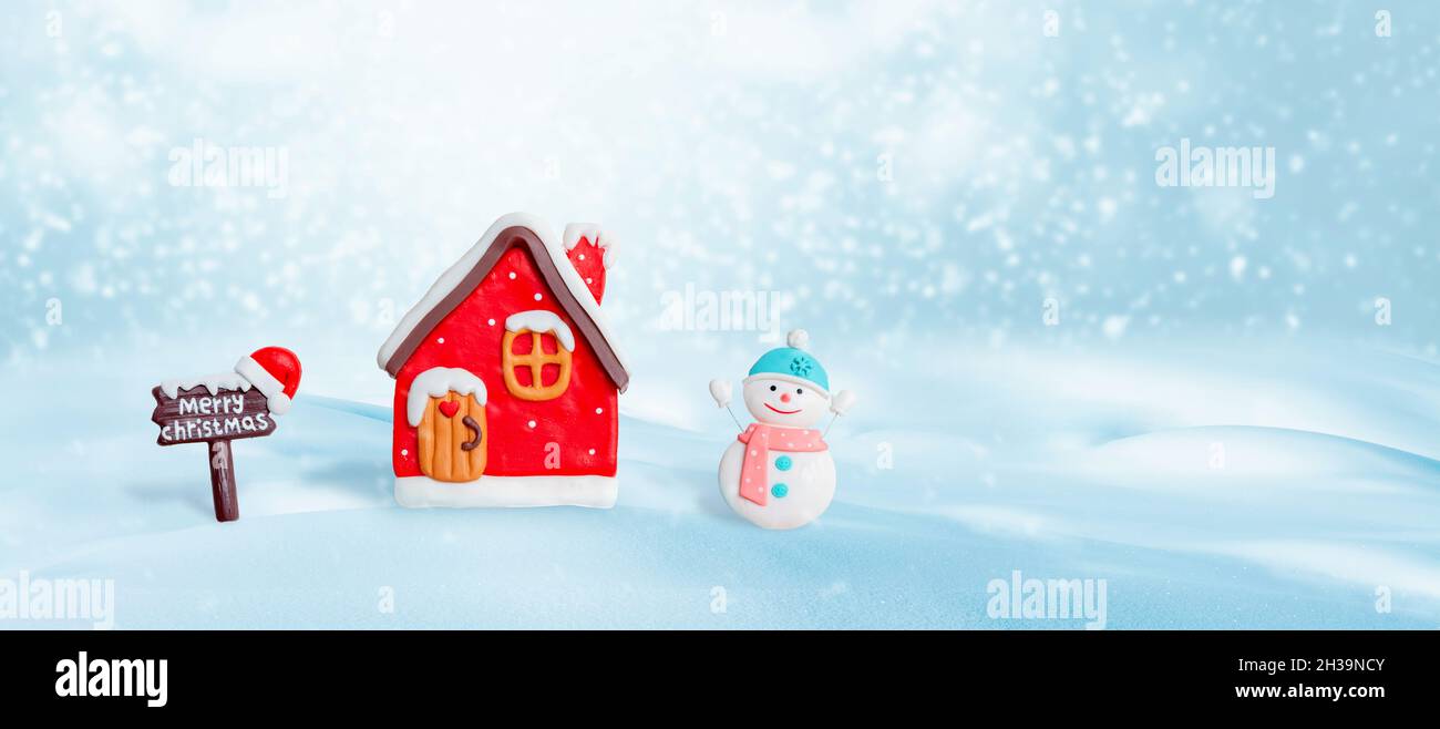 Small Christmas decorations on the snow with free space for greeting card text Stock Photo