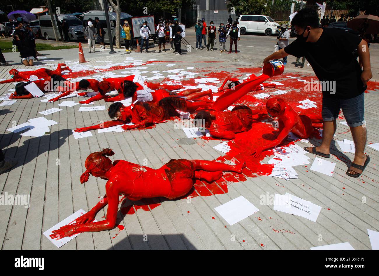 Bangkok, Thailand. 27th Oct, 2021. Protesters covered in red paint perform during the demonstration.Anti-government protesters gathered outside the Parliament in Bangkok demanding Prime Minister Prayuth Chan-ocha's resignation and the abolition of the 112 Lese-Majeste law. Credit: SOPA Images Limited/Alamy Live News Stock Photo