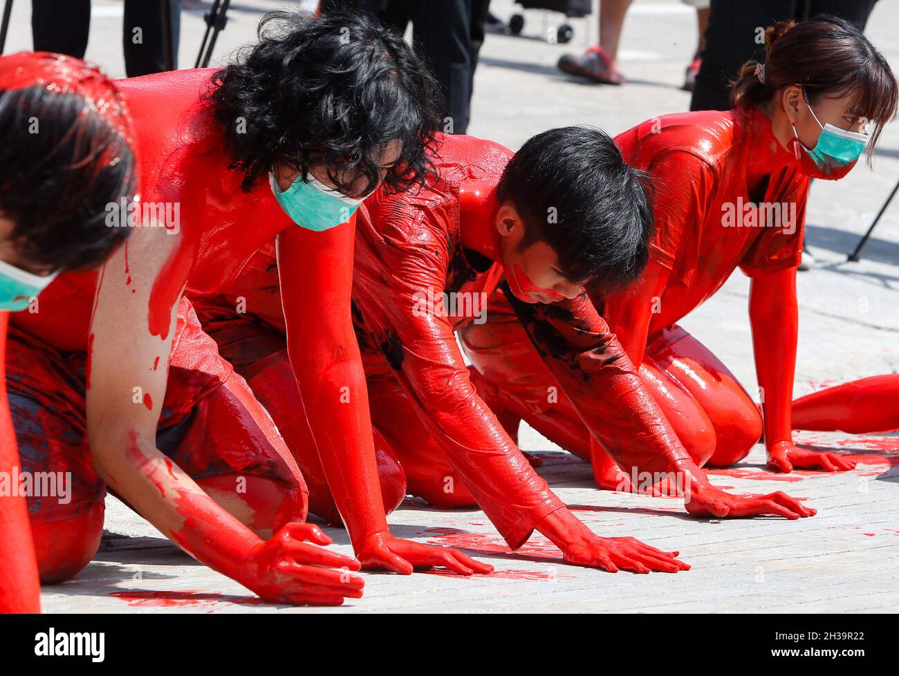 Bangkok, Thailand. 27th Oct, 2021. Protesters covered in red paint perform during the demonstration.Anti-government protesters gathered outside the Parliament in Bangkok demanding Prime Minister Prayuth Chan-ocha's resignation and the abolition of the 112 Lese-Majeste law. Credit: SOPA Images Limited/Alamy Live News Stock Photo