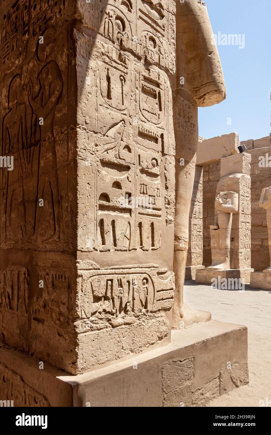 The statues of Pharaoh Ramses III as Osiris guarding the precinct of ...
