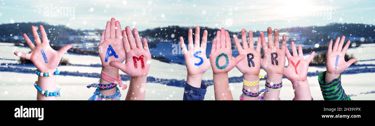 Children Hands Building Word I Am Sorry, Snowy Winter Background Stock Photo