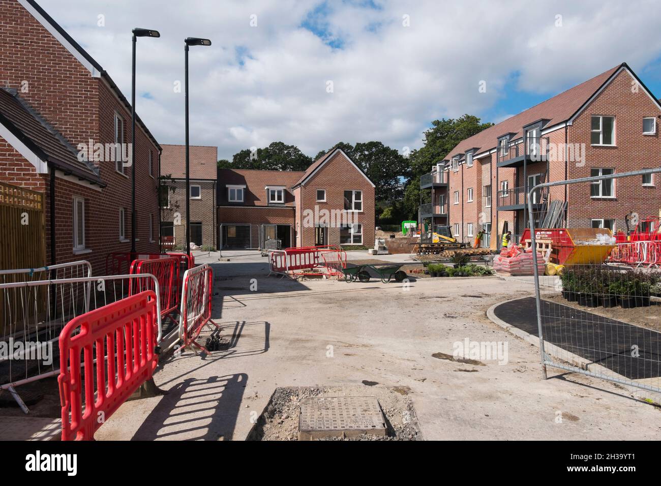 Builders finishing the flats, houses and roads at Keepers Green, the