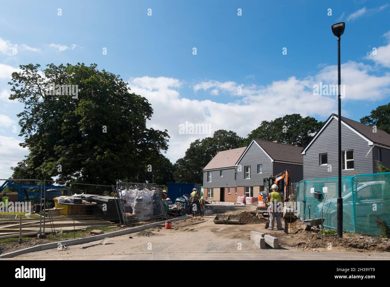 Builders finishing the flats, houses and roads at Keepers Green, the