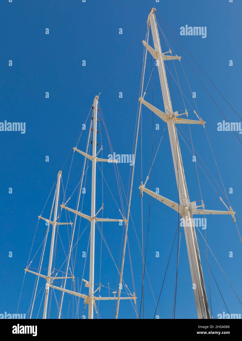Sailboat Masts. Sky in background. Three large masts isolated. Stock Image Stock Photo Alamy