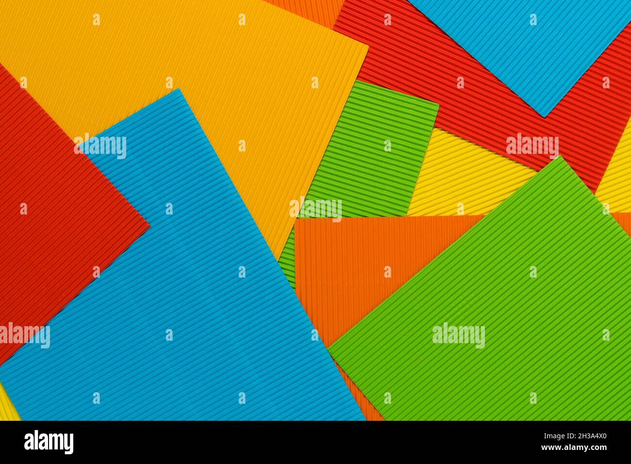 Striped colored embossed paper sheets. Colorful paper background Stock