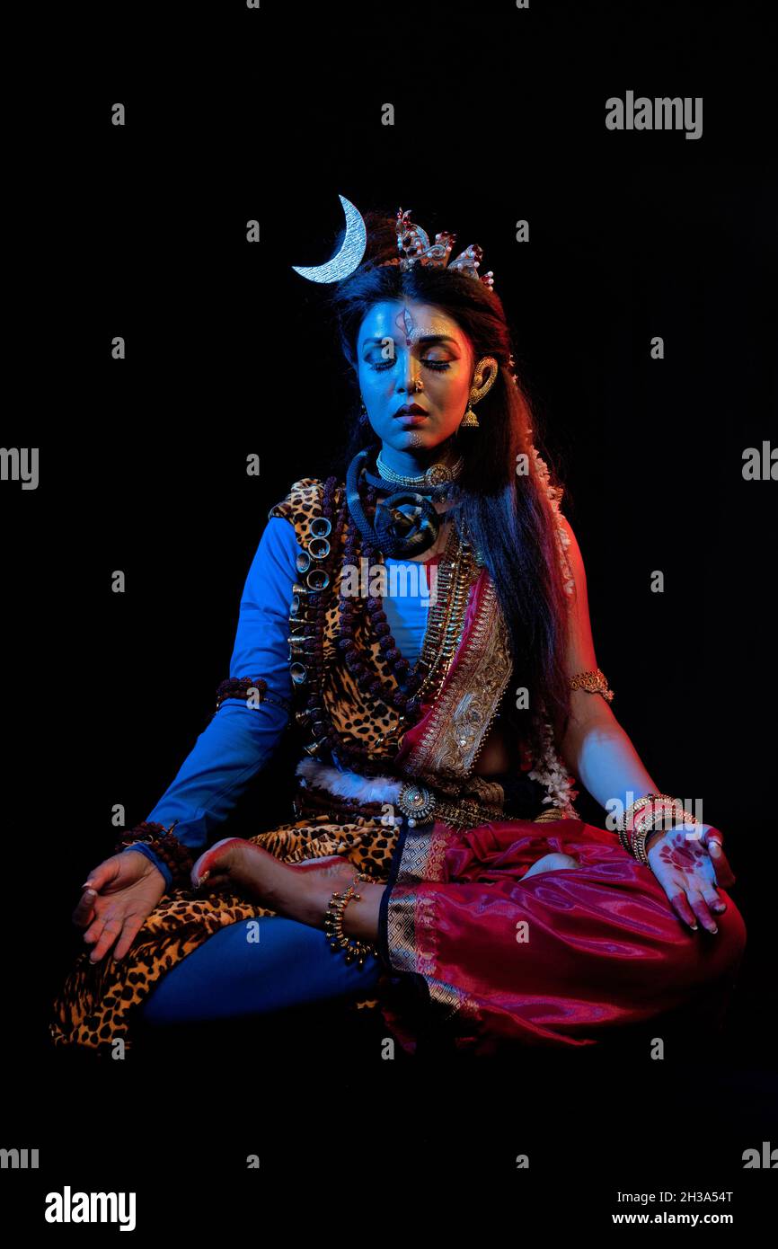 Indian female model in Ardhanarishvara makeup costume, a composite ...