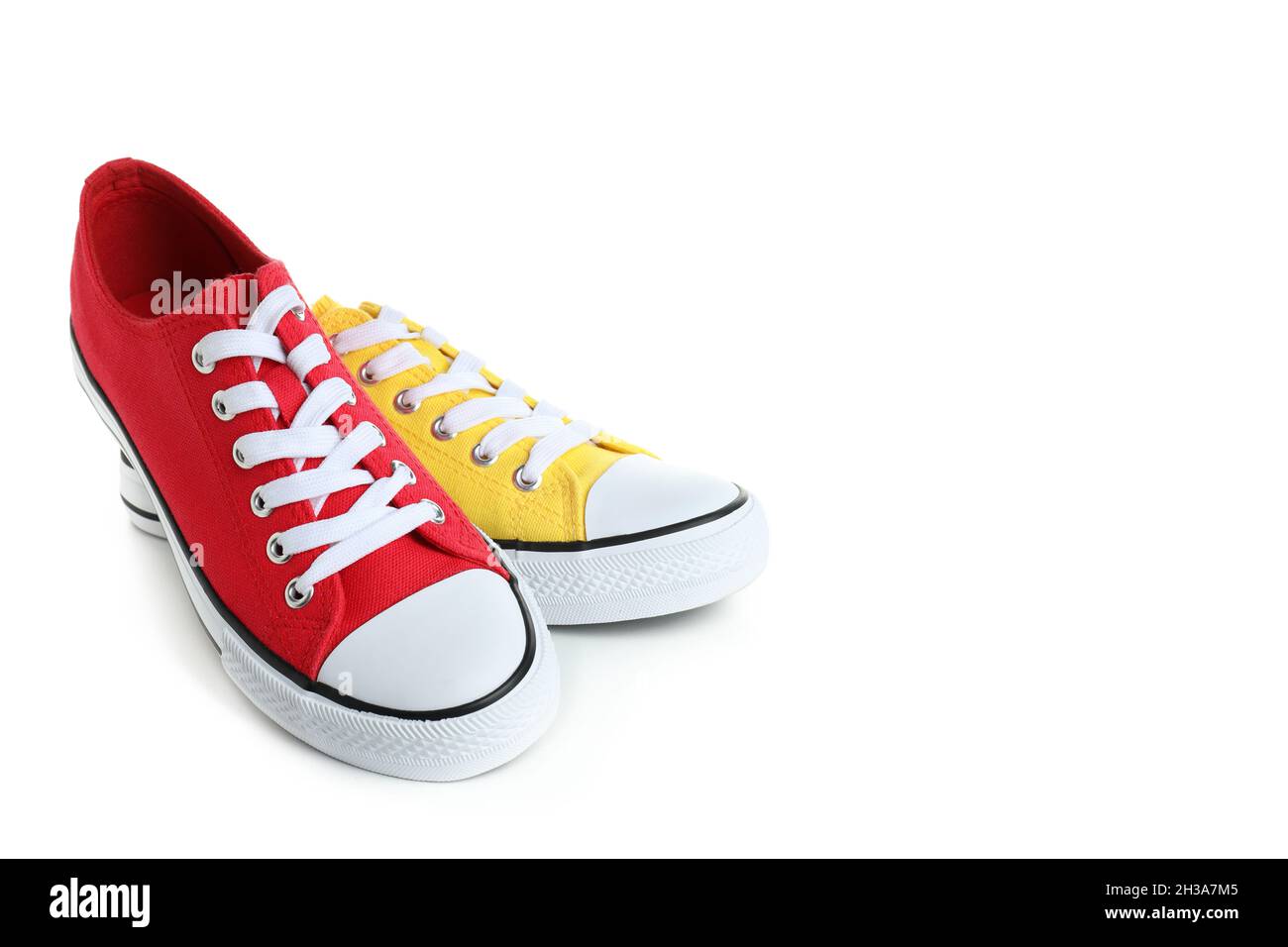 Pair of red and yellow sneakers isolated on white background Stock ...