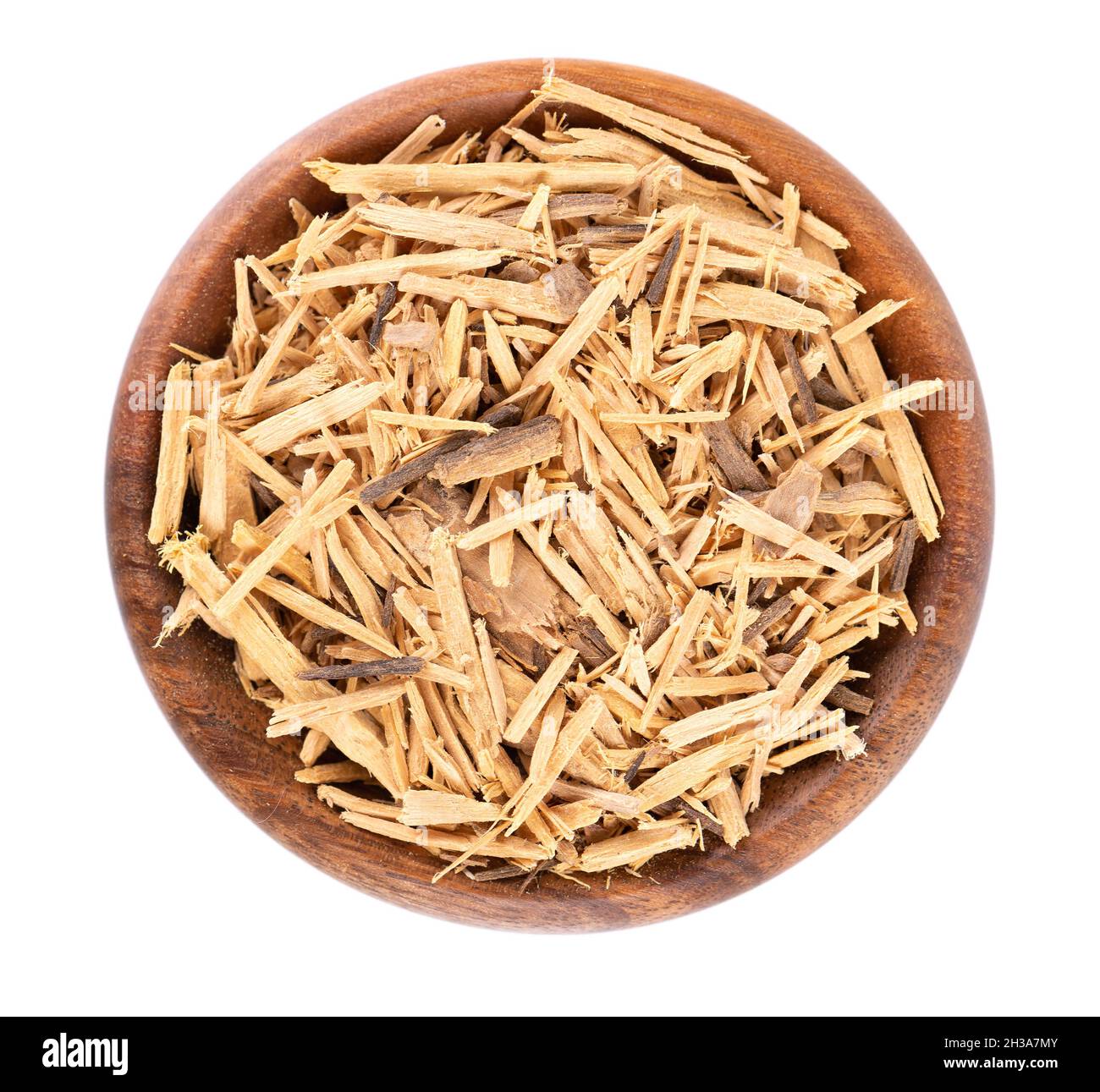 Muira Puama herbal tea in wooden bowl, isolated on white background. Natural potency wood