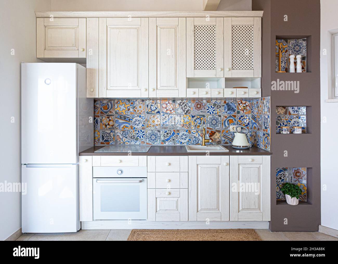 Front view of classic kitchen with modern tiles Stock Photo Alamy