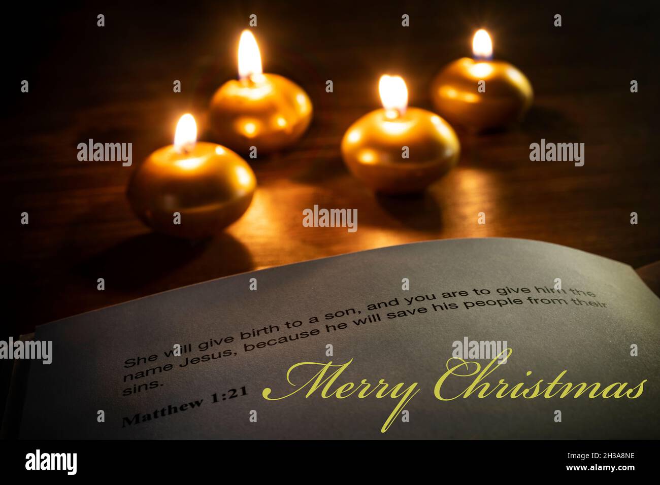 christmas bible verse with candles on the background Stock Photo