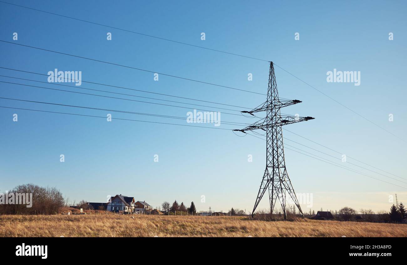 High voltage transmission tower on a field. Stock Photo