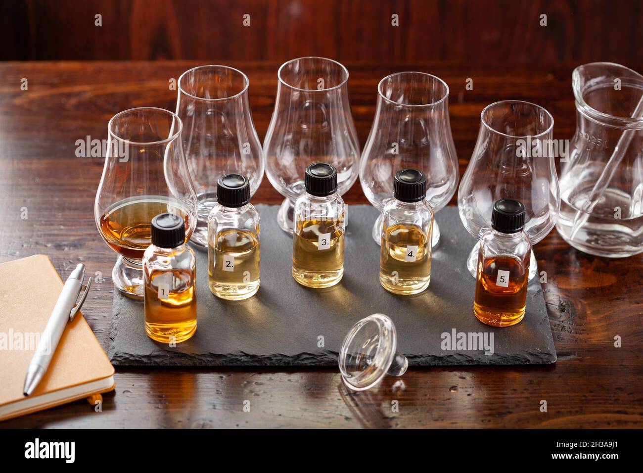 tasting bottles and glasses of whisky spirit brandy cognac. tasting at
