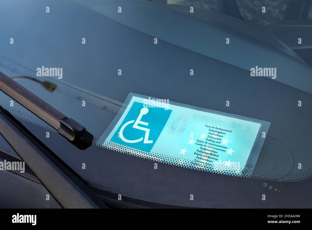 car sticker for parking in areas dedicated to the cars of disabled people Stock Photo