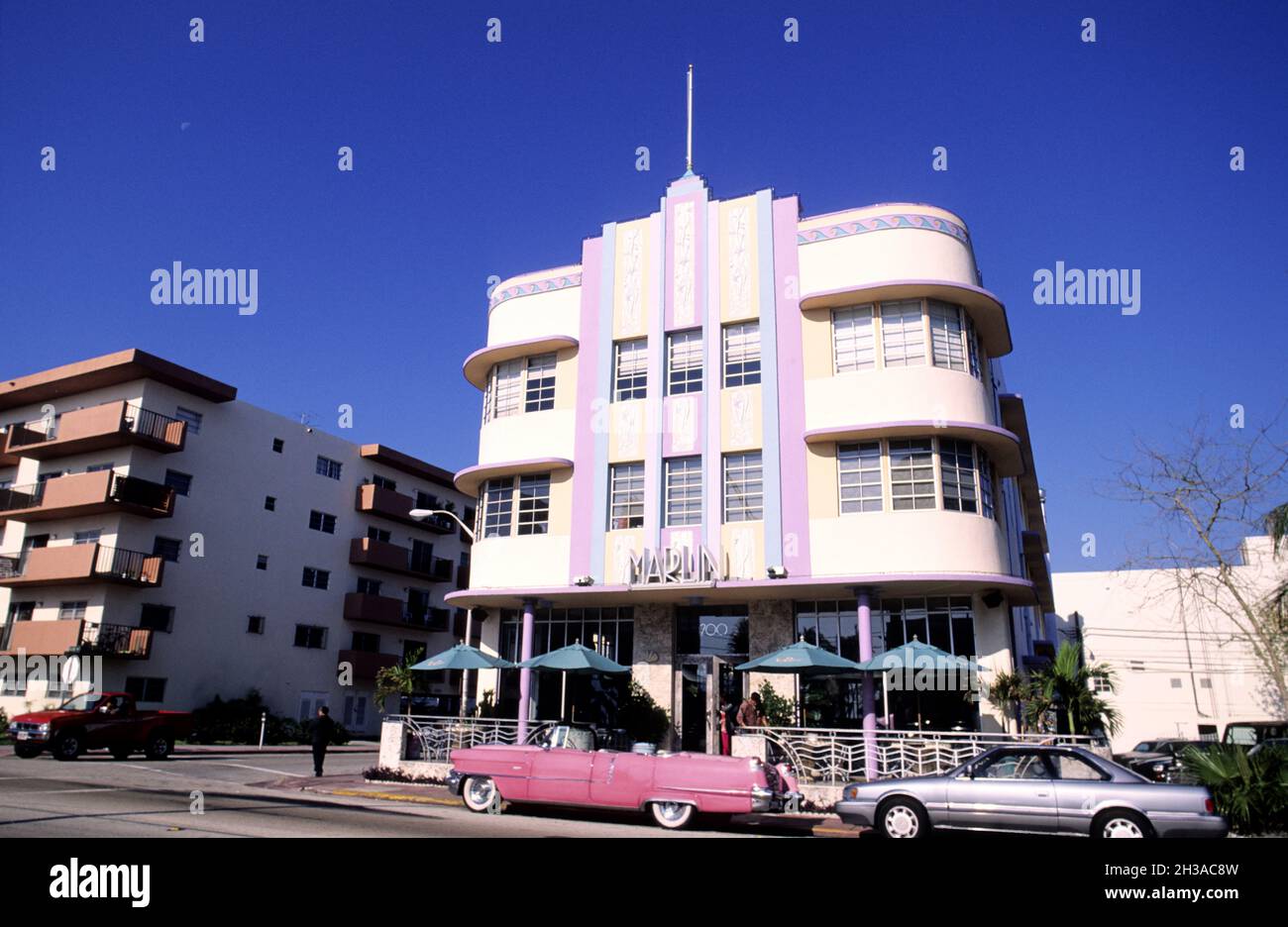 UNITED STATES, FLORIDA, MIAMI BEACH, PINK CADILLAC IN FRONT OF MARLIN HOTEL IN THE ART DECO DISTRICT Stock Photo