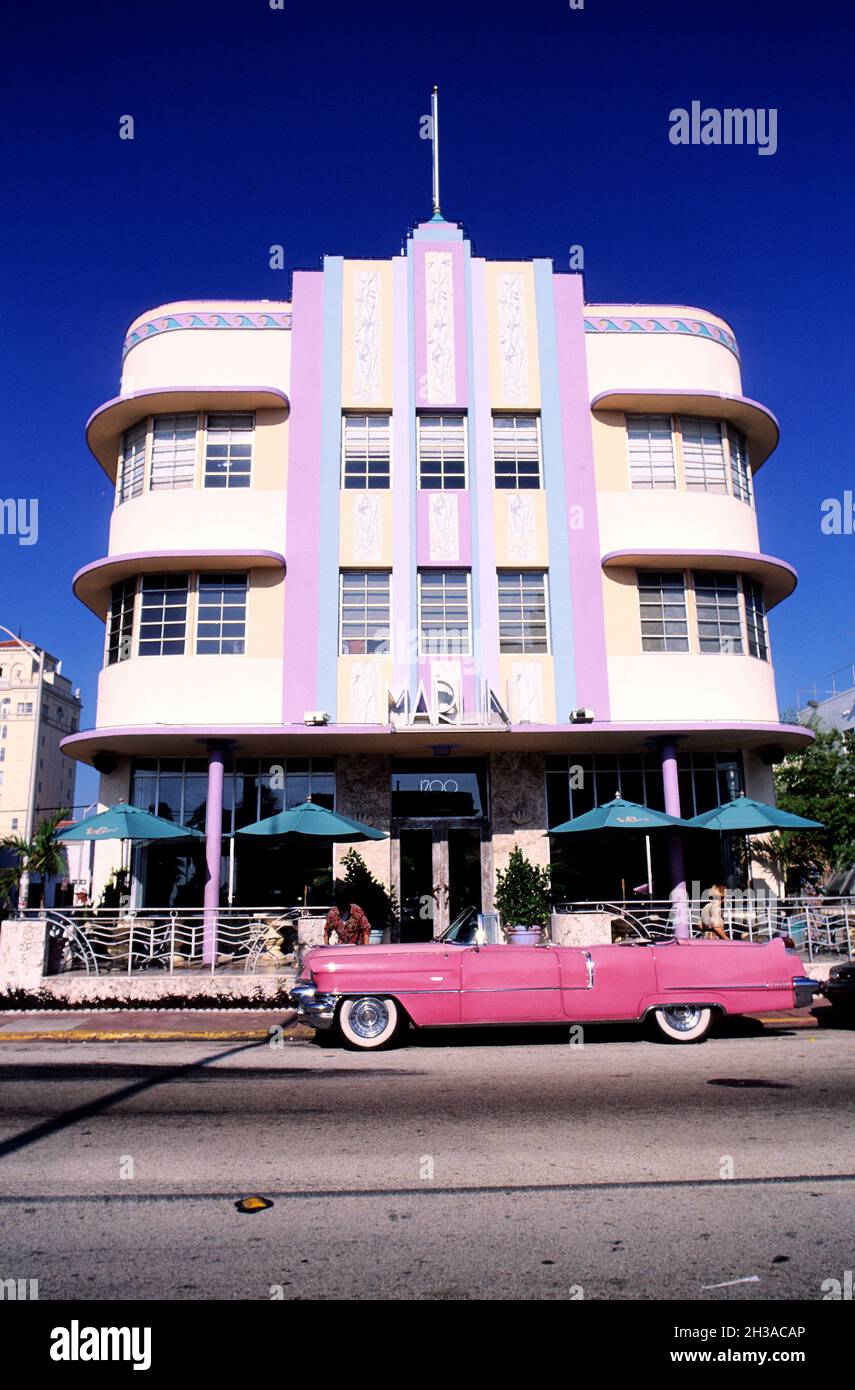 UNITED STATES, FLORIDA, MIAMI BEACH, PINK CADILLAC IN FRONT OF THE MARLIN HOTEL IN THE ART DECO DISTRICT Stock Photo