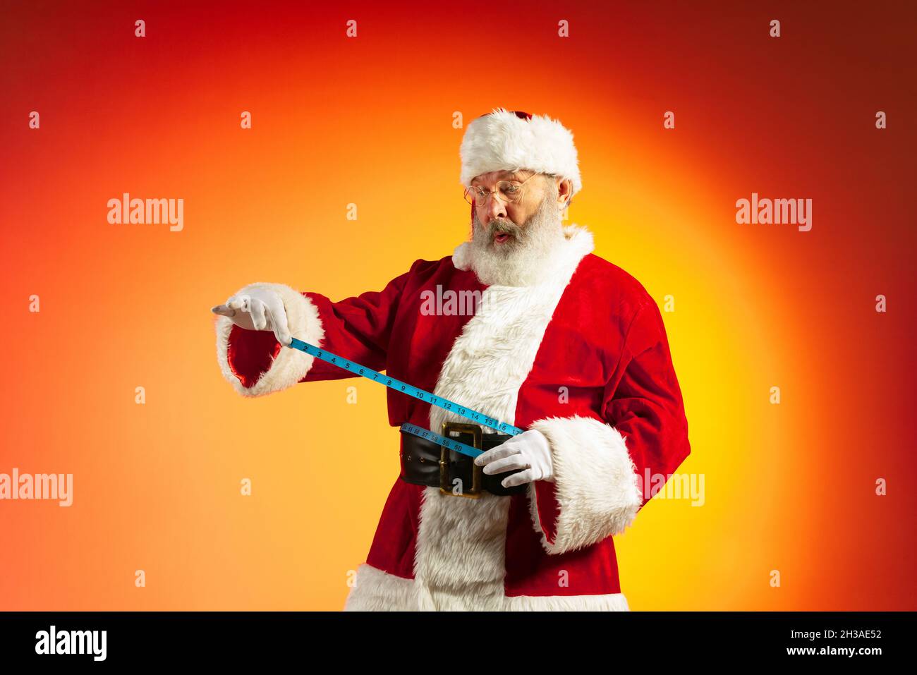 Father Christmas 2022 Emotional Senior Man, Santa Claus Posing Isolated On Red Yellow Background  In Neon. Healthy New Year 2022 Stock Photo - Alamy