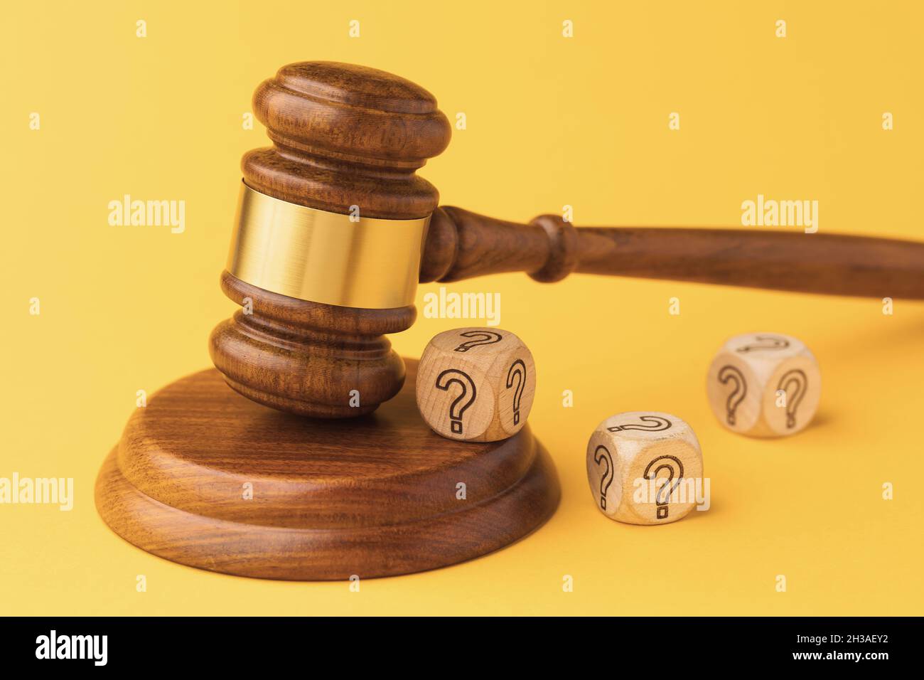 Judge gavel and wooden cubes with question mark, guilt or innocence concept Stock Photo