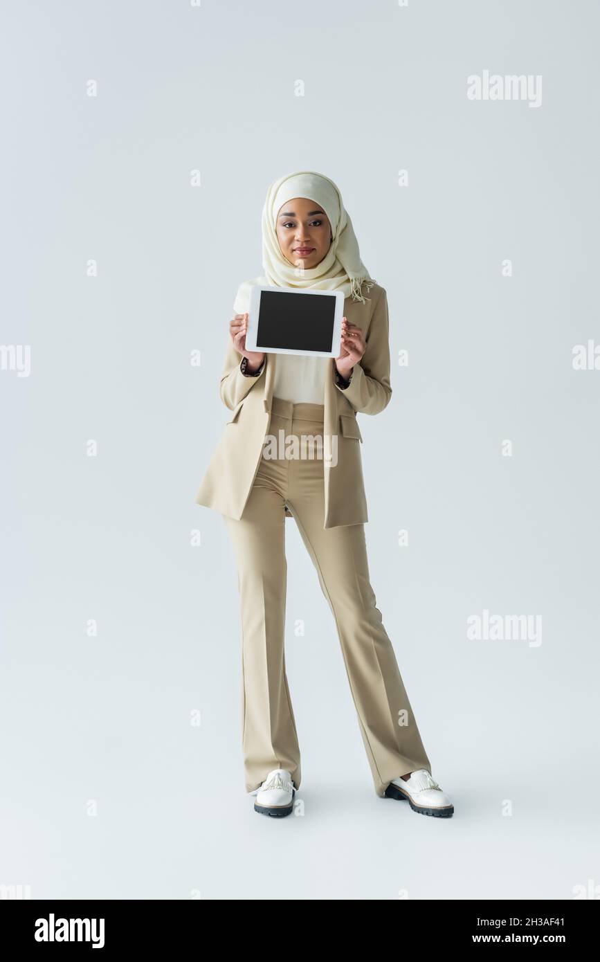 full length of pleased muslim woman in 