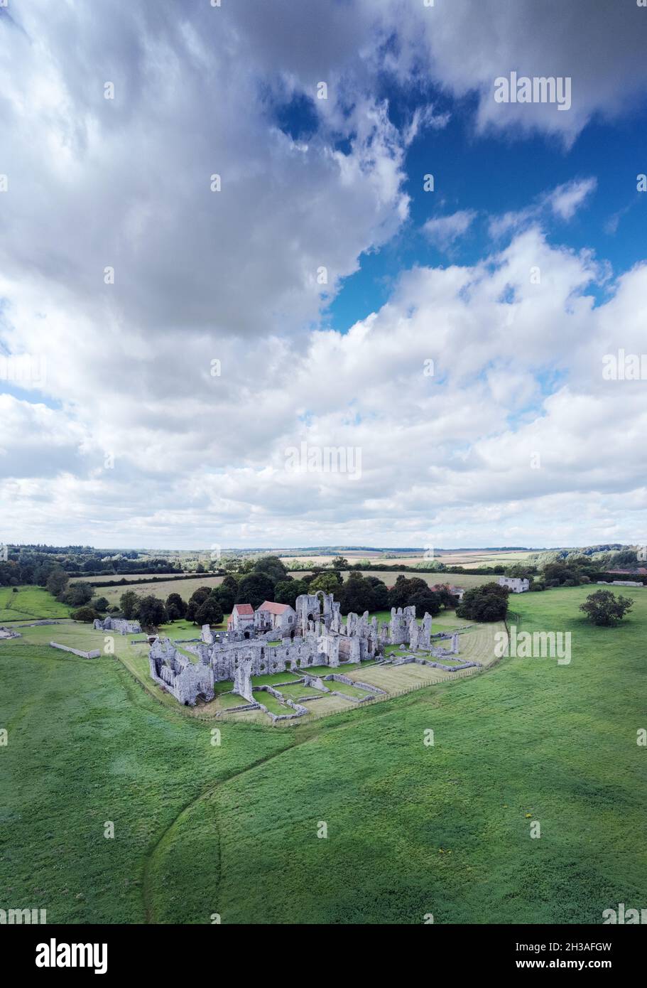 landscape image of the ruins of  Castle Acre Priory a medieval building in the village of Castle Acre Norfolk England Stock Photo