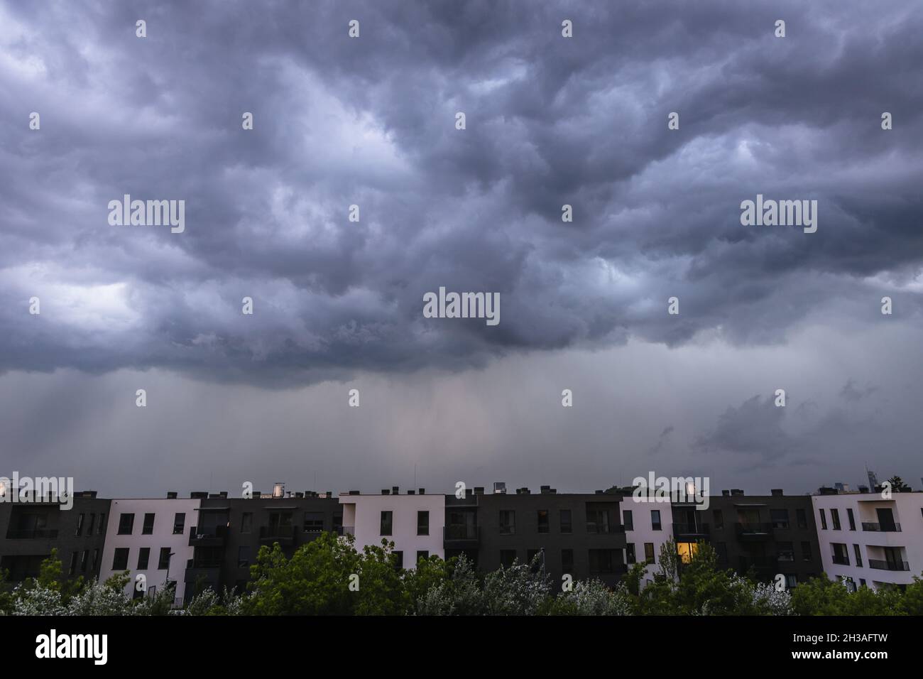 Rainy clouds over apartment houses in Warsaw, Poland Stock Photo