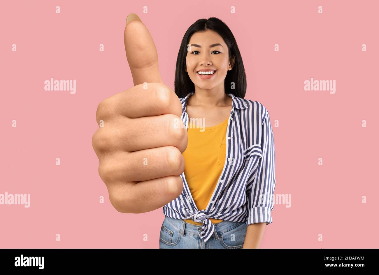 Happy asian woman thumb up hi-res stock photography and images - Alamy