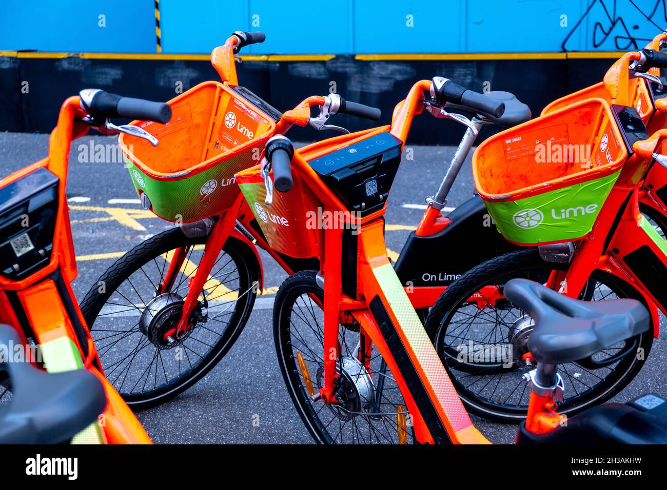Collection Of Lime Environmentally Friendly Green Travel Or Transport Electric Push Bikes Parked In Central London Stock Photo